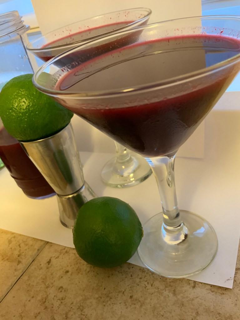 Black Forest and Elder Flower Cordial Daiquiri's in two martini glasses and two limes