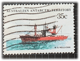 Australian Antarctic Territory 35 cent stamp with an image of a red ship by MS Nella Dan.MV Nella Dan was one of the famous 'Dan' ships of the Danish J. Lauritzen A/S Lines that were almost synonymous with ANARE (Australian National Antarctic Research Expeditions)